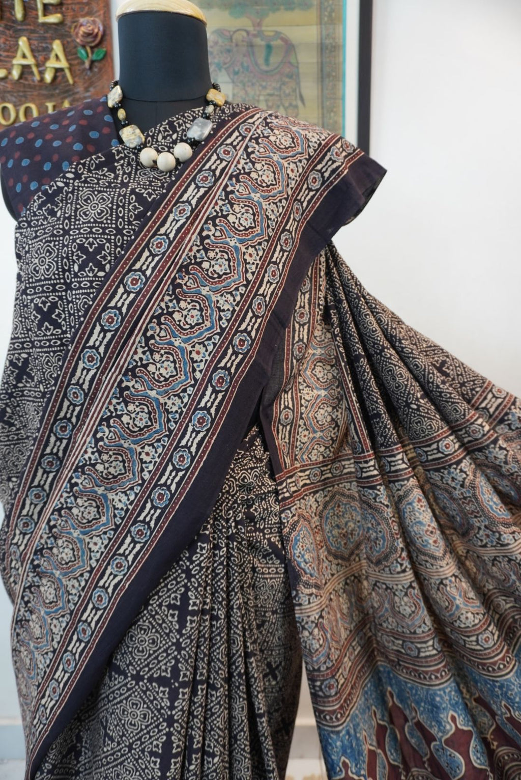 Black Ajrakh cotton saree with all-over pattern, blue beige and maroon details, and border
