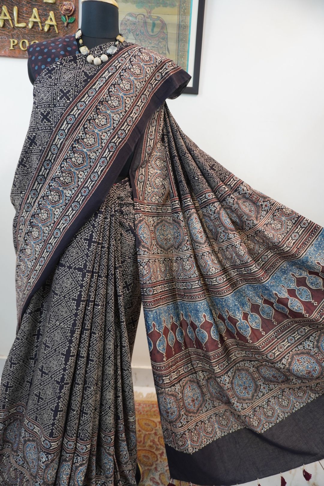 Black Ajrakh cotton saree with all-over pattern, blue beige and maroon details, and border