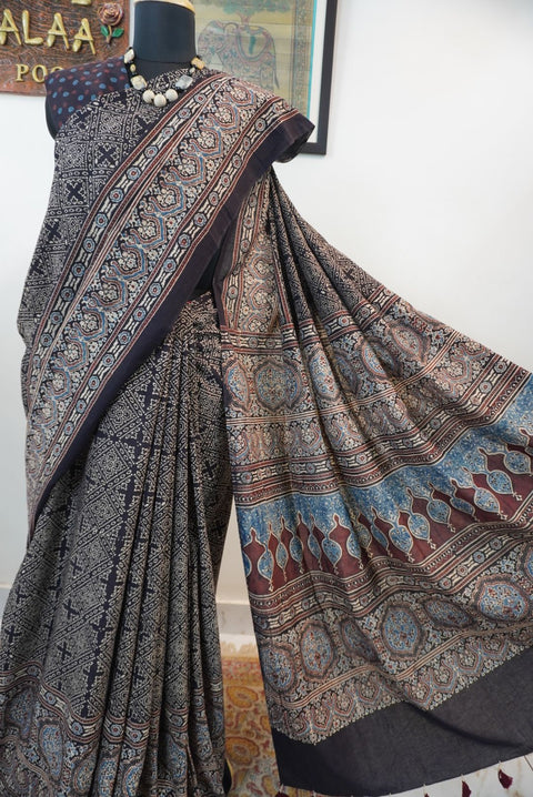 Black Ajrakh cotton saree with all-over pattern, blue beige and maroon details, and border