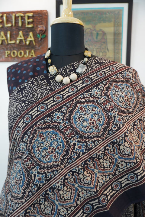 Black Ajrakh cotton saree with all-over pattern, blue beige and maroon details, and border