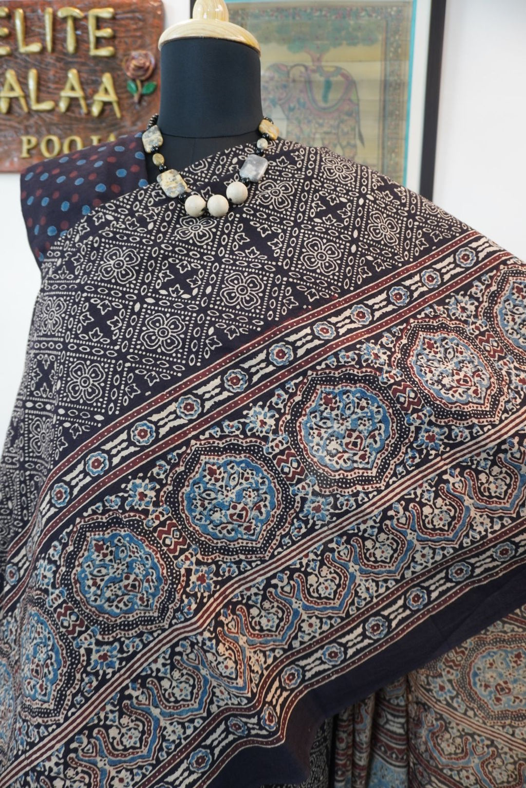Black Ajrakh cotton saree with all-over pattern, blue beige and maroon details, and border