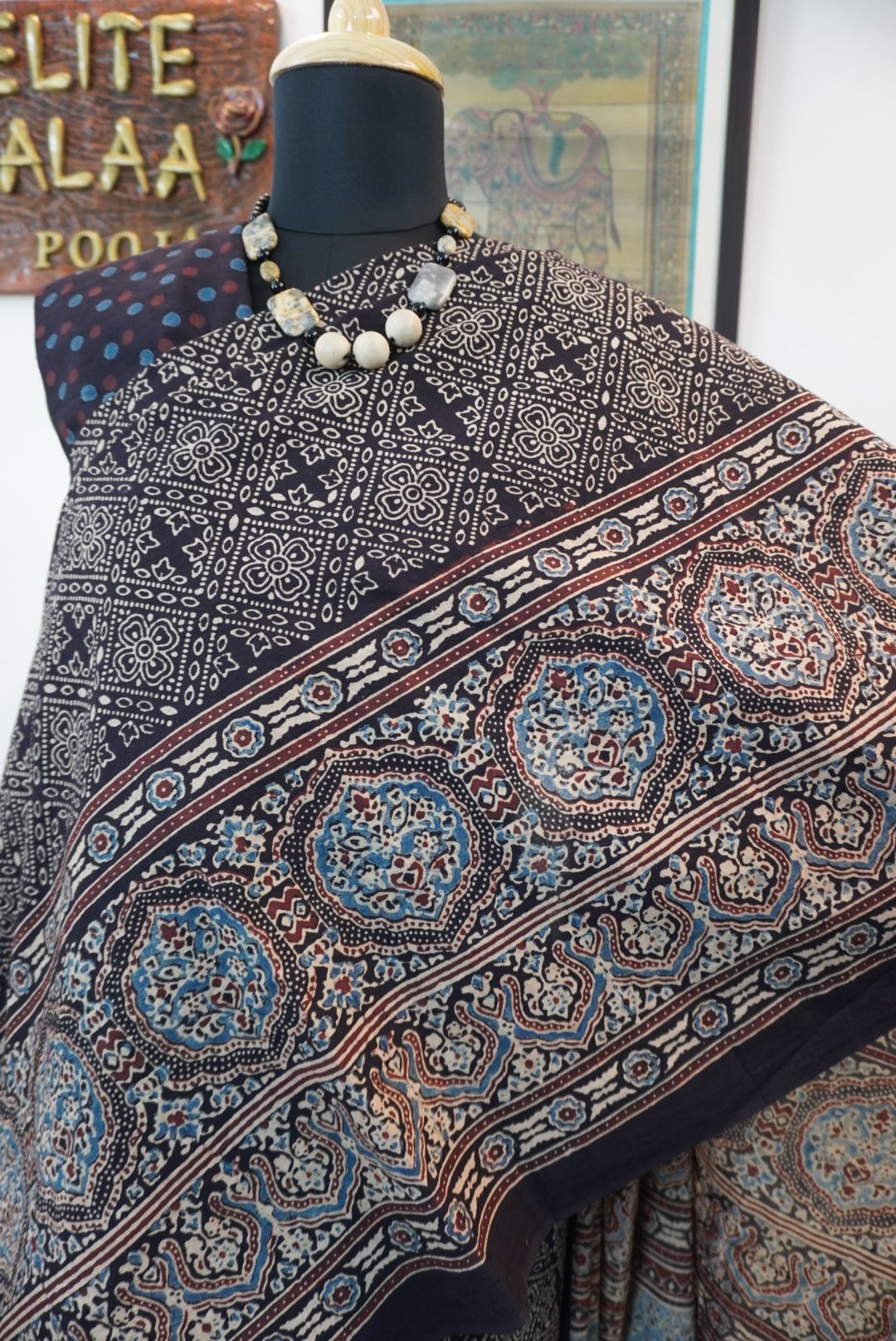 Black Ajrakh cotton saree with all-over pattern, blue beige and maroon details, and border