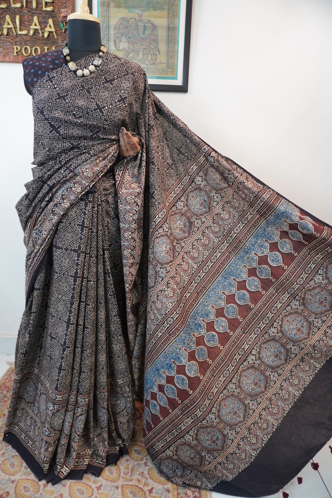 Black Ajrakh cotton saree with all-over pattern, blue beige and maroon details, and border