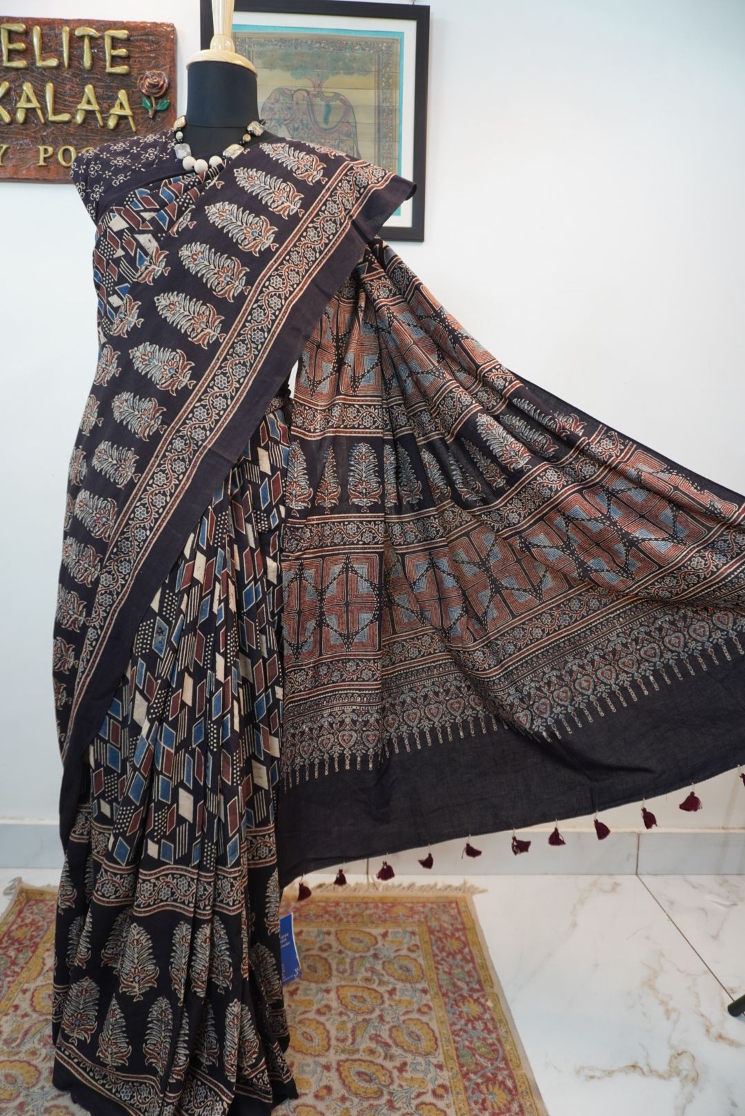 Black Ajrakh cotton saree with cream, rust and blue detailing, border and tassels