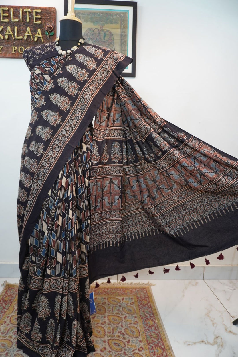 Black Ajrakh cotton saree with cream, rust and blue detailing, border and tassels
