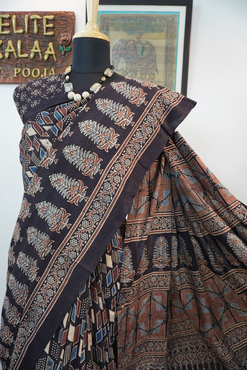 Black Ajrakh cotton saree with cream, rust and blue detailing, border and tassels