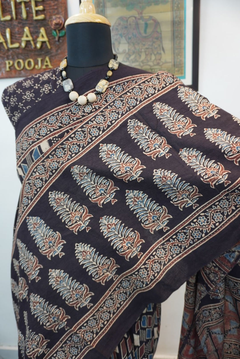 Black Ajrakh cotton saree with cream, rust and blue detailing, border and tassels