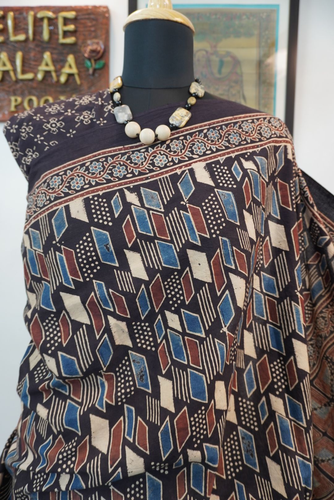 Black Ajrakh cotton saree with cream, rust and blue detailing, border and tassels