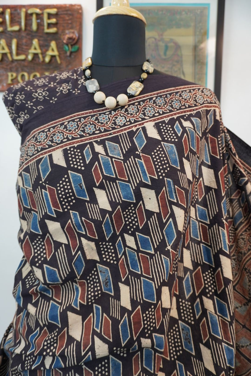 Black Ajrakh cotton saree with cream, rust and blue detailing, border and tassels