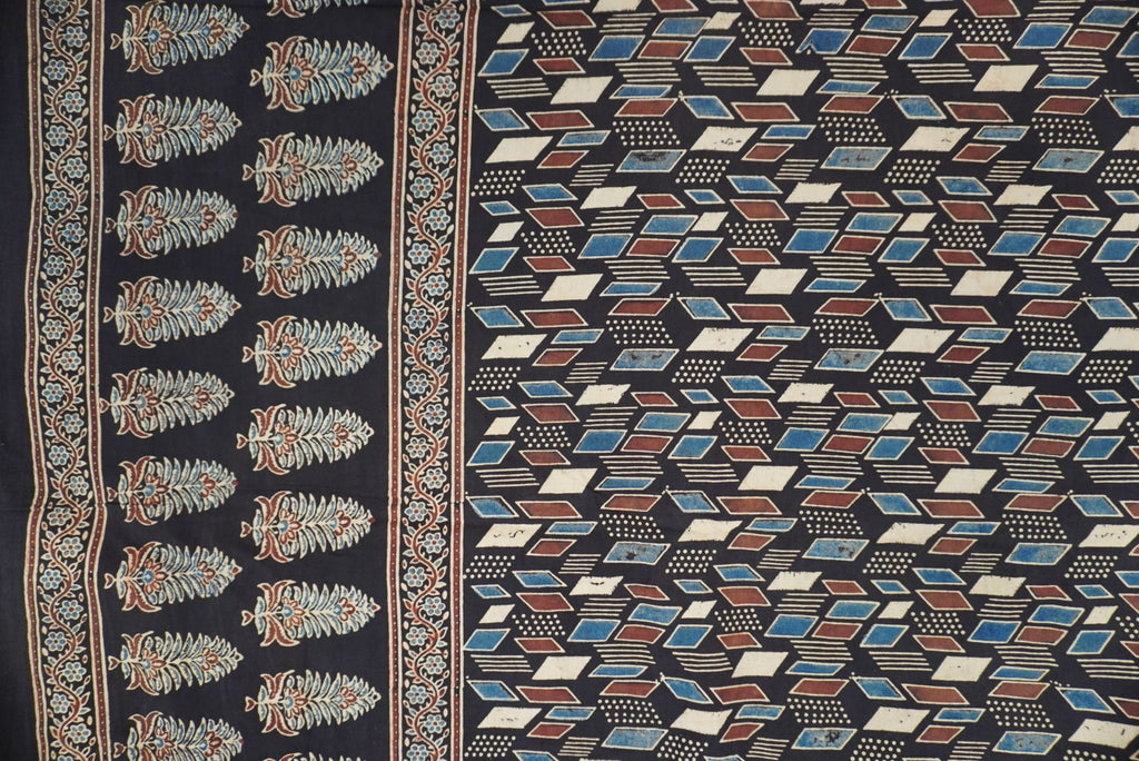 Black Ajrakh cotton saree with cream, rust and blue detailing, border and tassels