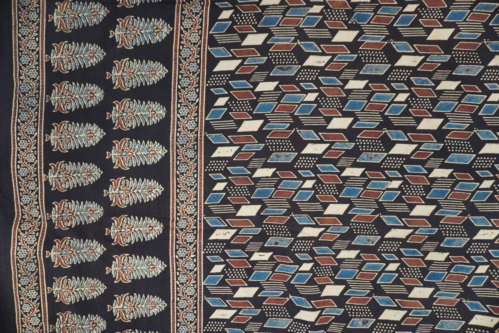 Black Ajrakh cotton saree with cream, rust and blue detailing, border and tassels