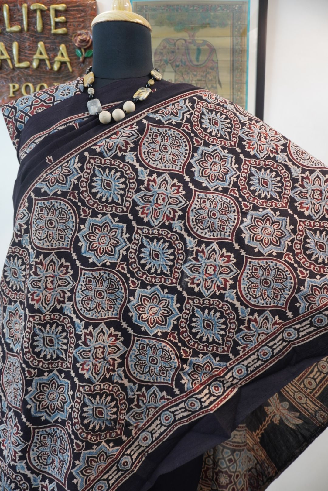 Black Ajrakh cotton saree with blue, red and cream border detail