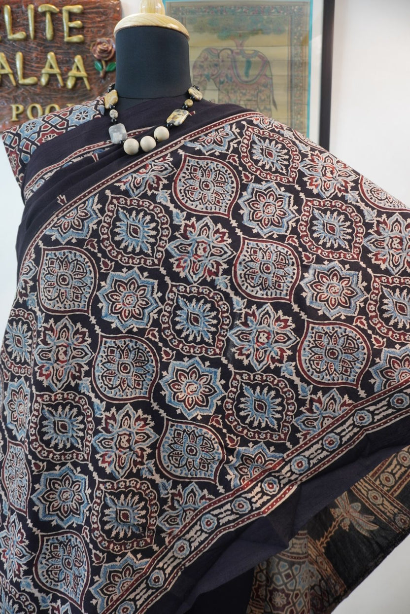 Black Ajrakh cotton saree with blue, red and cream border detail