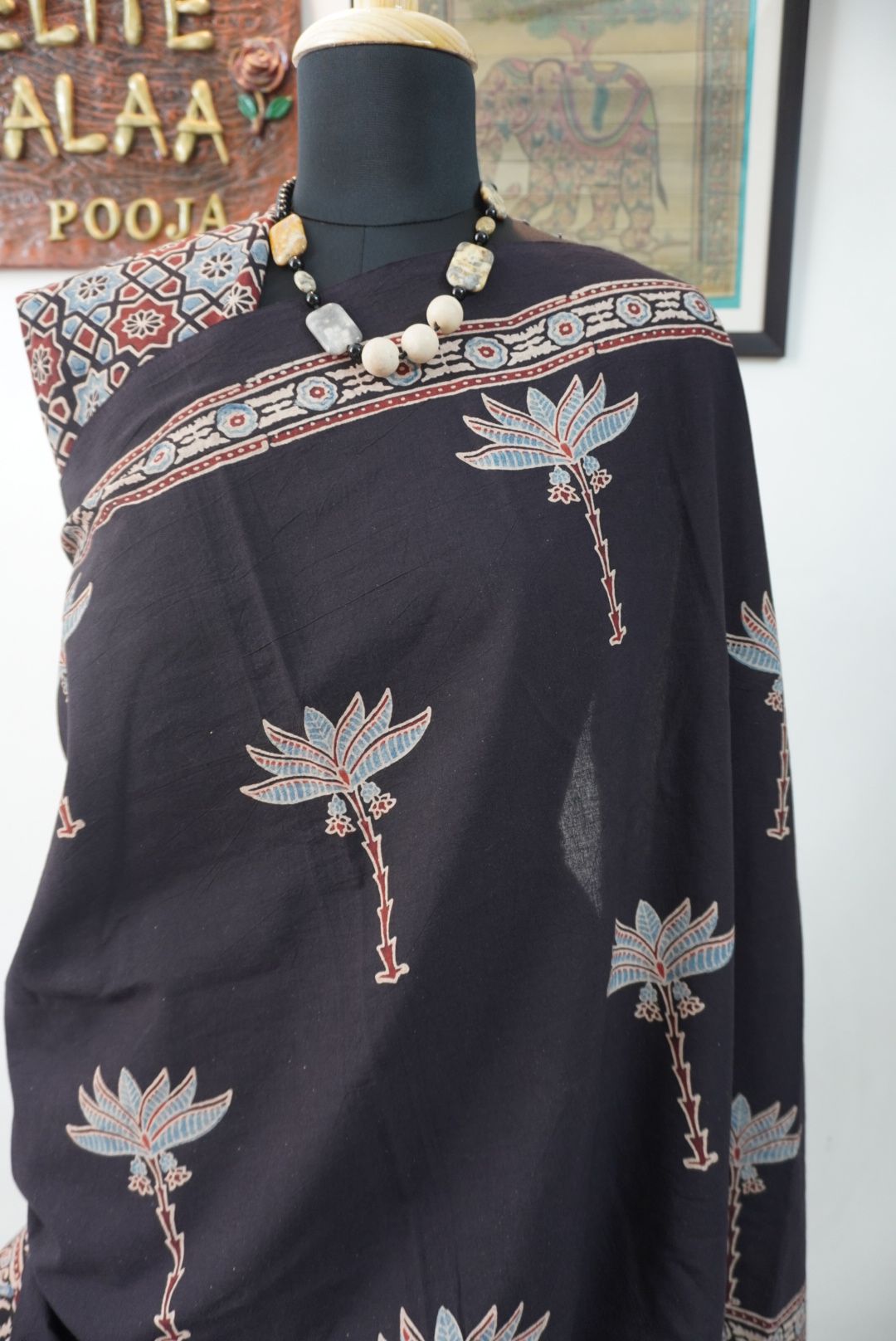 Black Ajrakh cotton saree with blue, red and cream border detail