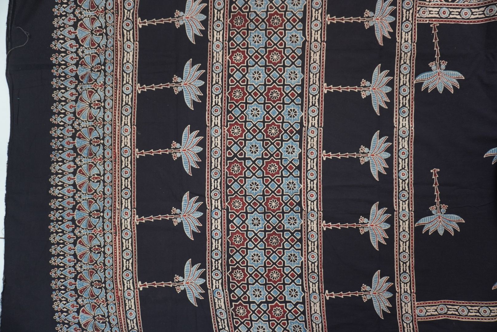Black Ajrakh cotton saree with blue, red and cream border detail