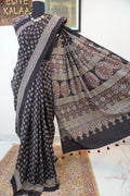 Black Ajrakh cotton saree with multicolor block print, border and tassels