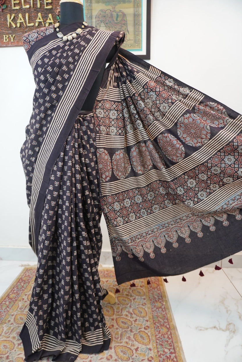 Black Ajrakh cotton saree with multicolor block print, border and tassels
