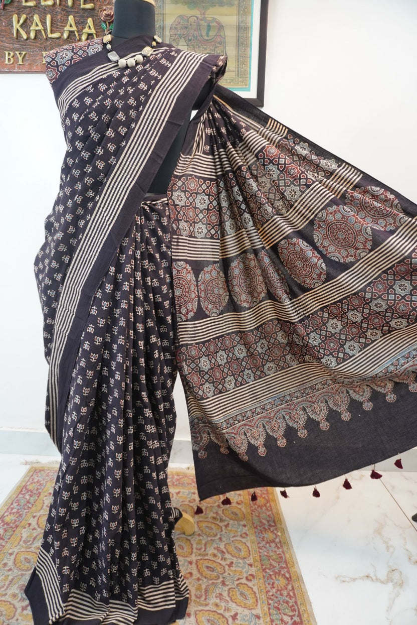 Black Ajrakh cotton saree with multicolor block print, border and tassels