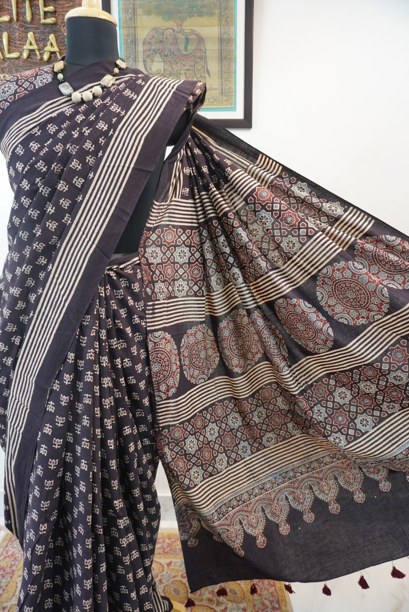 Black Ajrakh cotton saree with multicolor block print, border and tassels