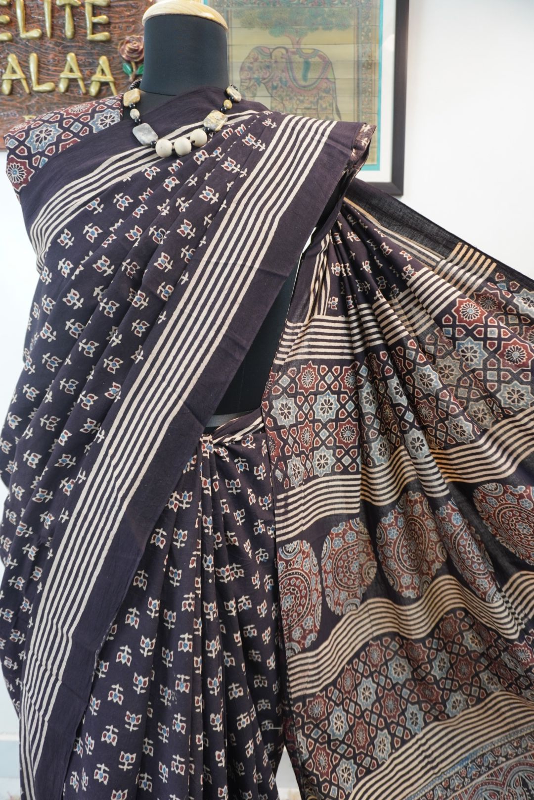 Black Ajrakh cotton saree with multicolor block print, border and tassels
