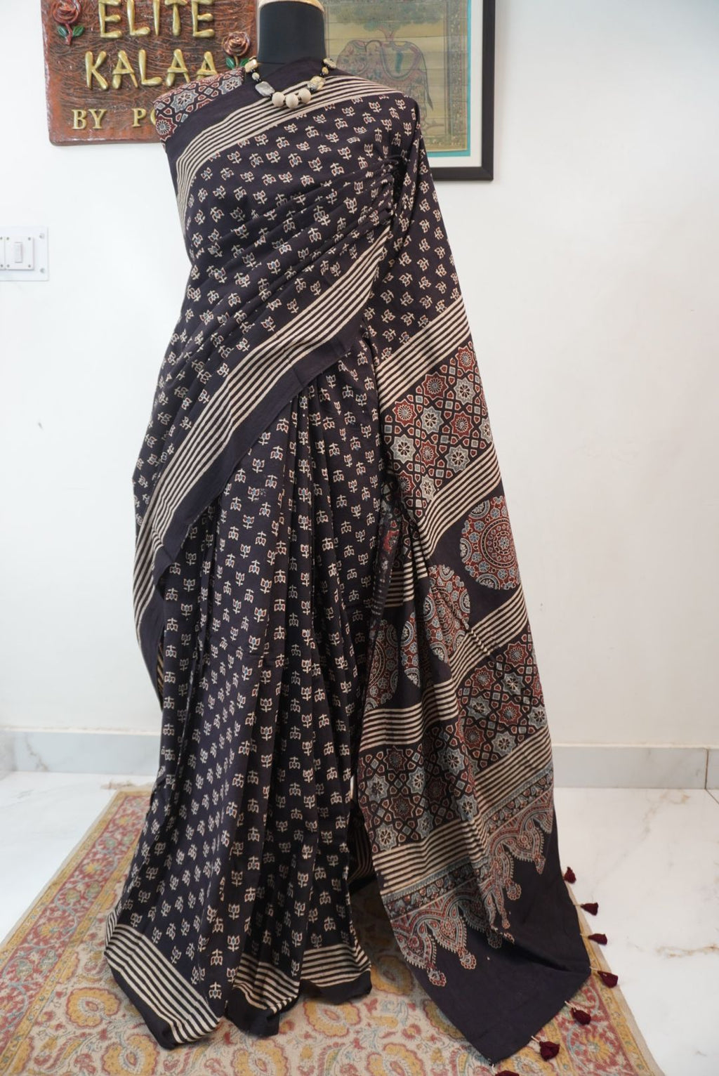 Black Ajrakh cotton saree with multicolor block print, border and tassels