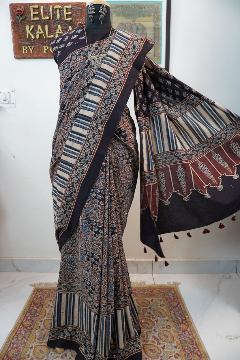 Black Ajrakh cotton saree with intricate jaal design, beige blue and maroon accents, border and tassels