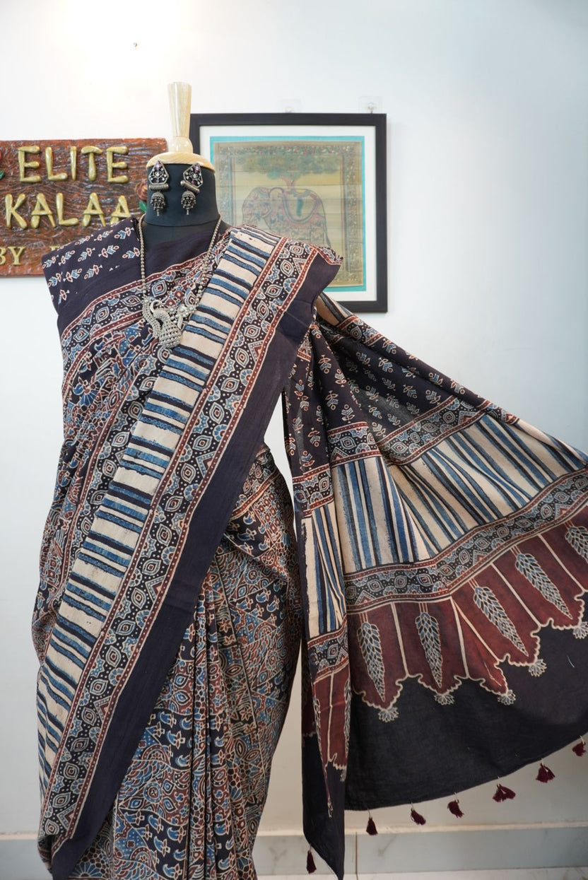 Black Ajrakh cotton saree with intricate jaal design, beige blue and maroon accents, border and tassels