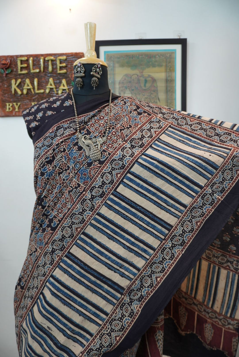 Black Ajrakh cotton saree with intricate jaal design, beige blue and maroon accents, border and tassels