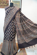 Black Ajrakh cotton saree with small flower and chevron design, border and tassels