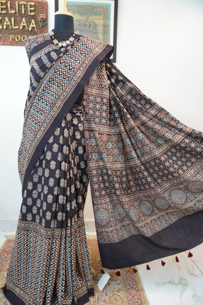Black Ajrakh cotton saree with small flower and chevron design, border and tassels