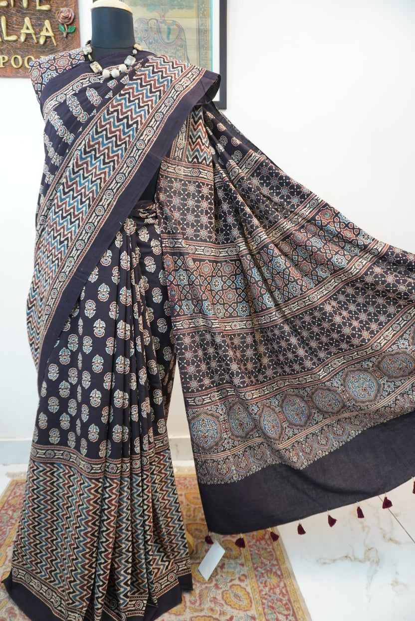 Black Ajrakh cotton saree with small flower and chevron design, border and tassels