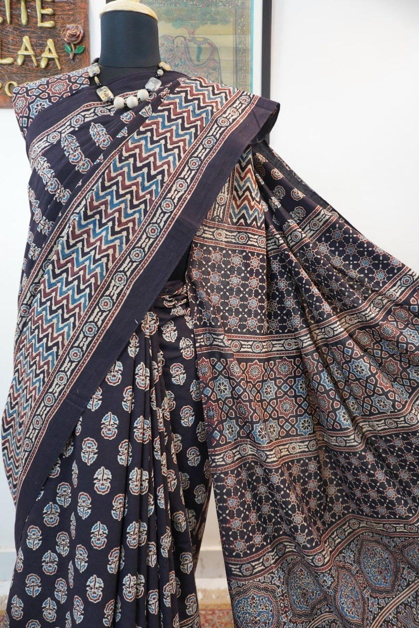 Black Ajrakh cotton saree with small flower and chevron design, border and tassels