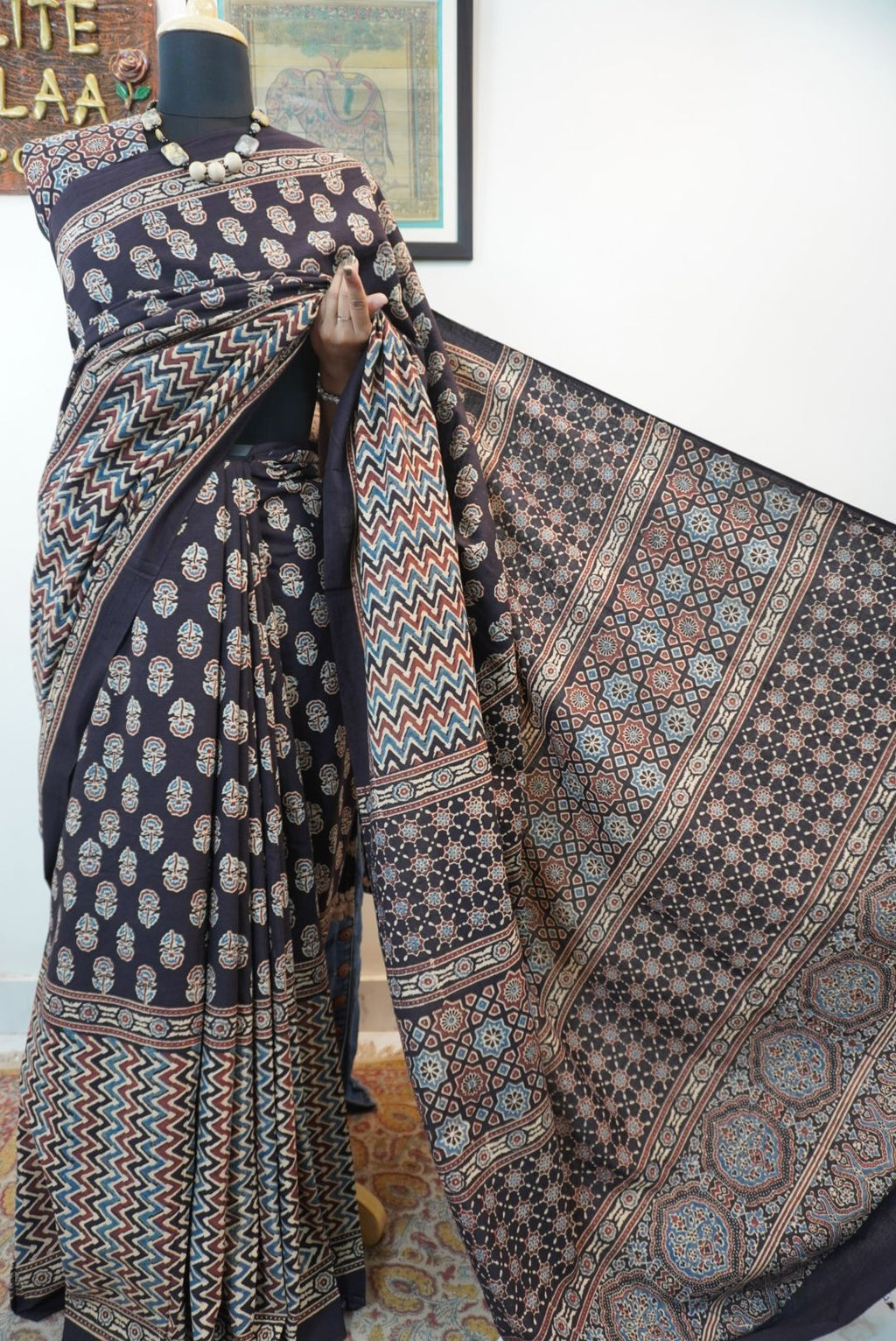 Black Ajrakh cotton saree with small flower and chevron design, border and tassels