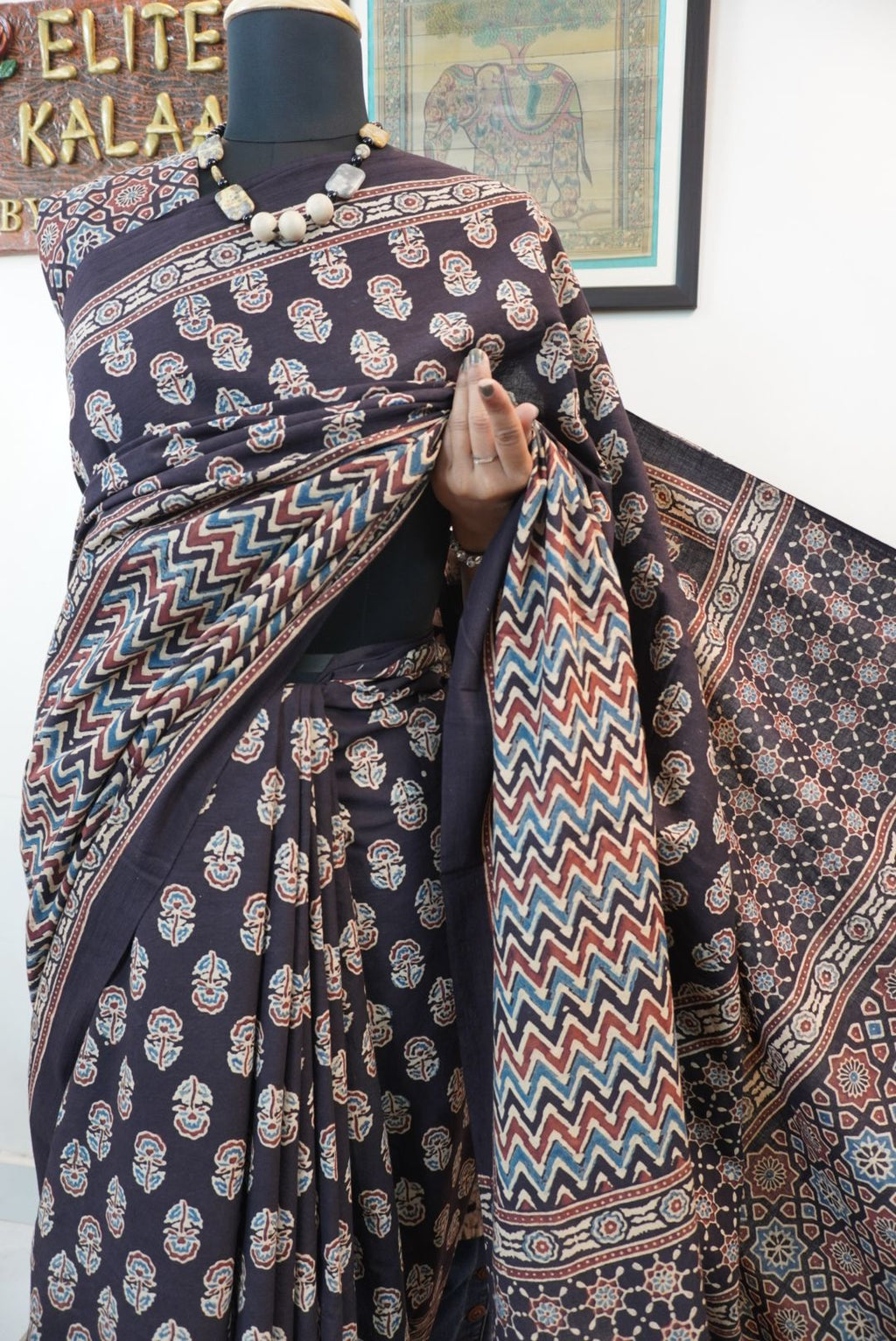 Black Ajrakh cotton saree with small flower and chevron design, border and tassels