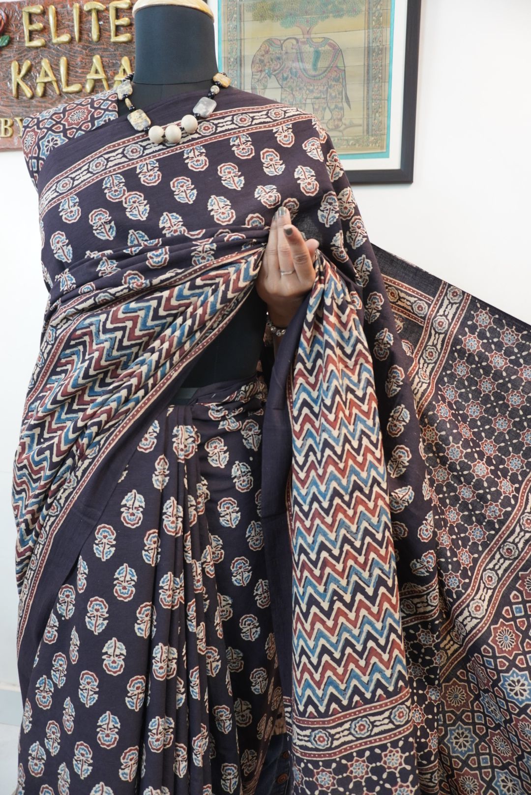 Black Ajrakh cotton saree with small flower and chevron design, border and tassels