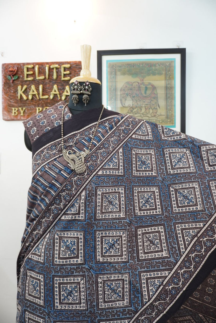 Brown Ajrakh cotton saree with blue and cream geometric stripes and a border