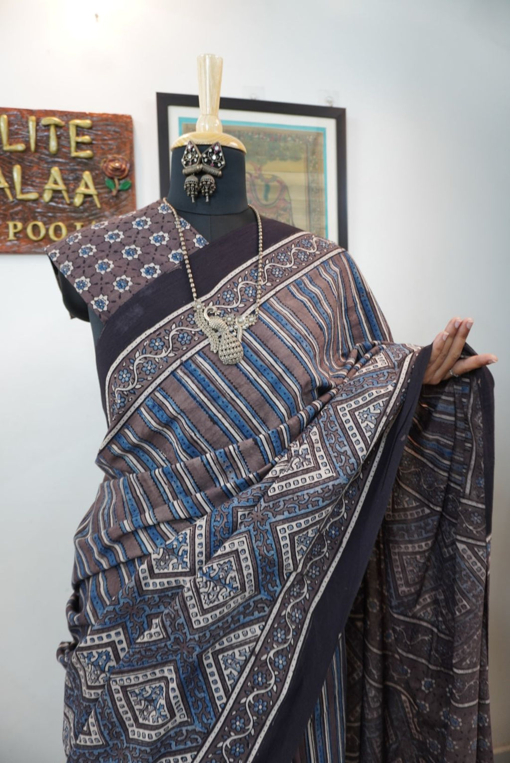 Brown Ajrakh cotton saree with blue and cream geometric stripes and a border