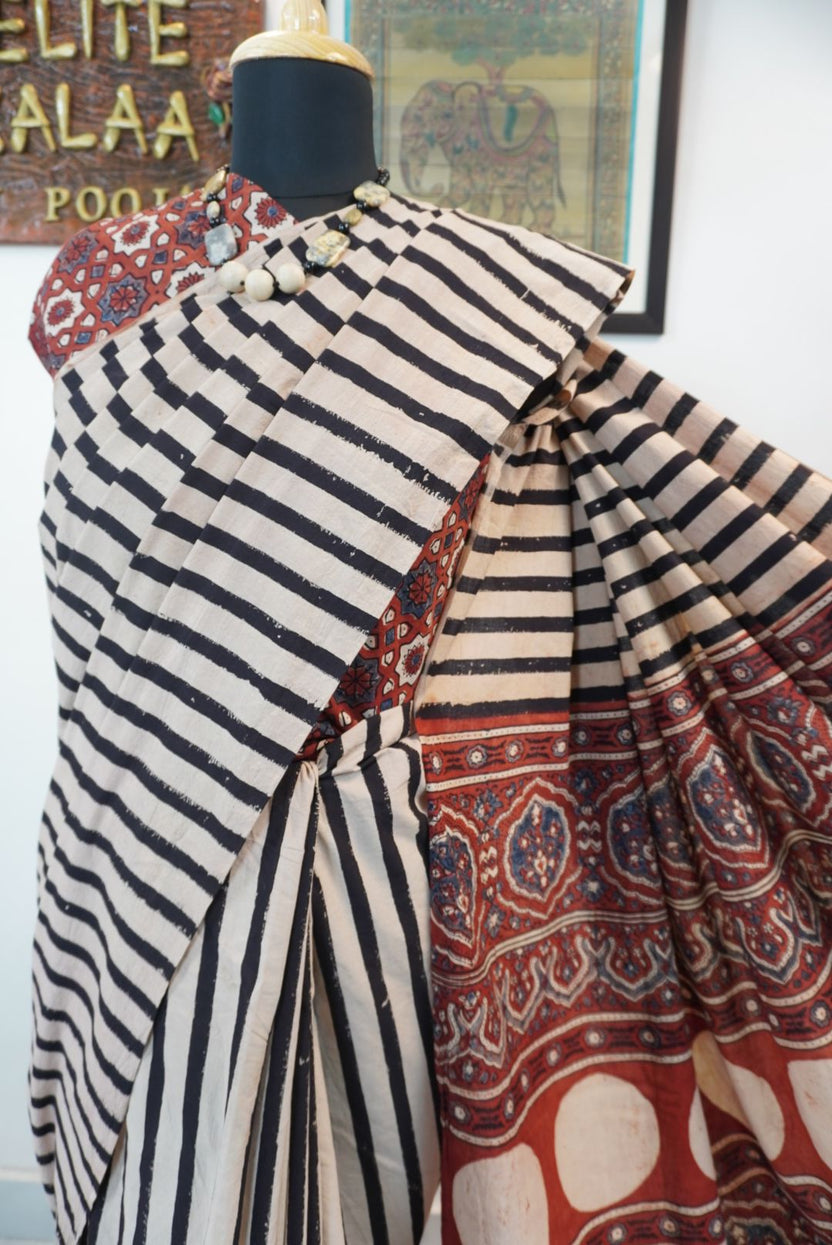 Cream Ajrakh cotton saree with red and black stripes and a border