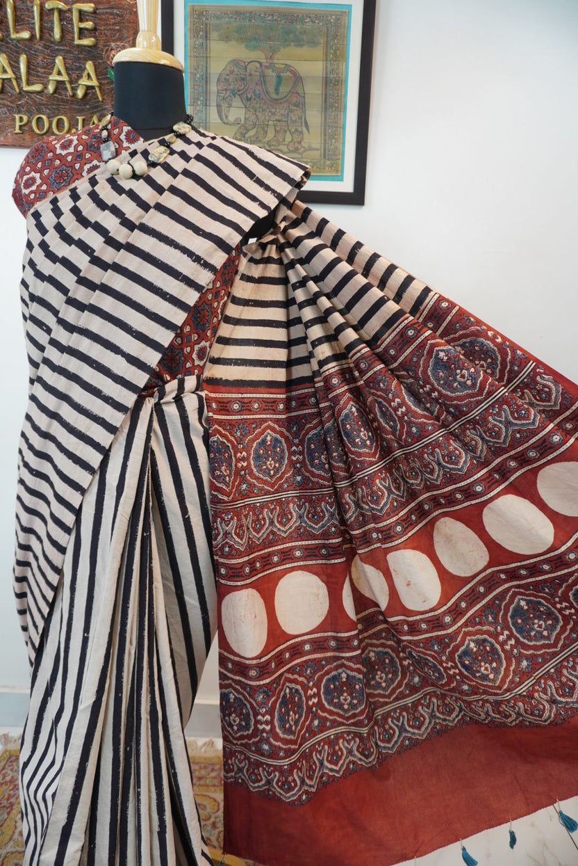 Cream Ajrakh cotton saree with red and black stripes and a border
