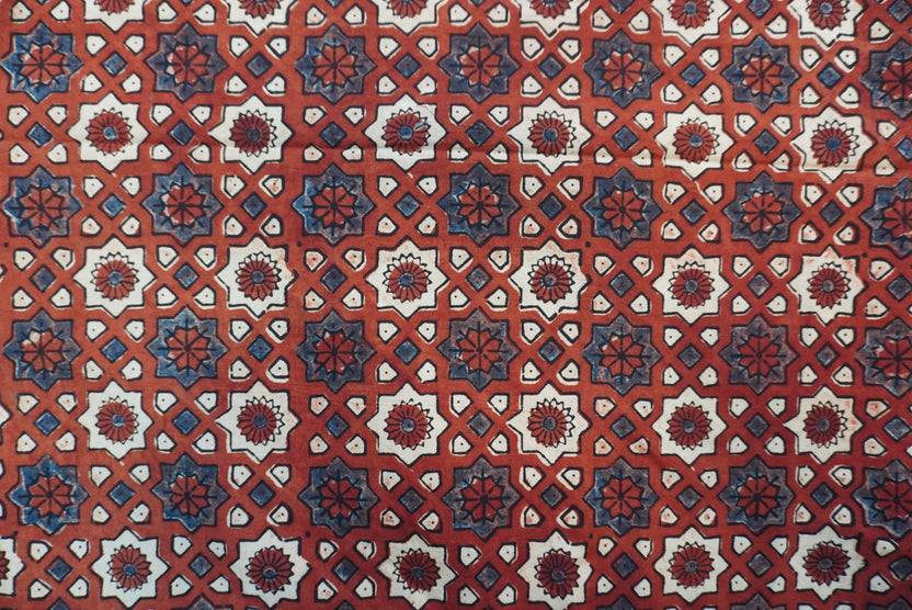 Red Ajrakh cotton saree with geometric circle design in white, blue and black