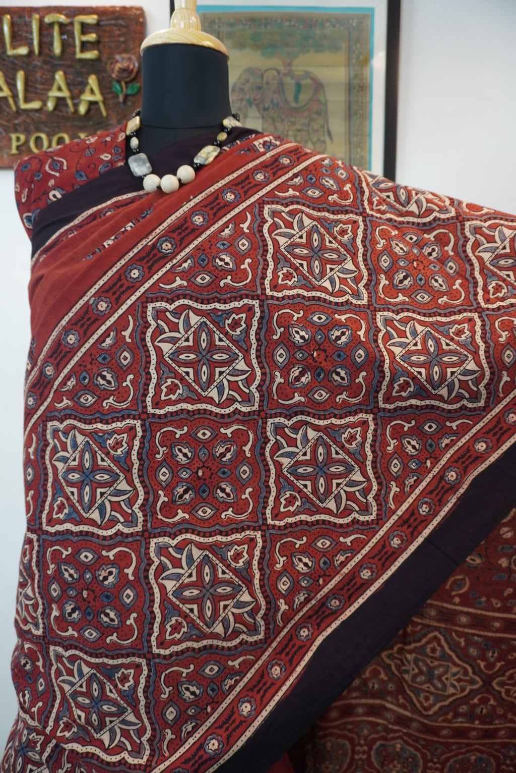 Red Ajrakh cotton saree with geometric circle design in white, blue and black