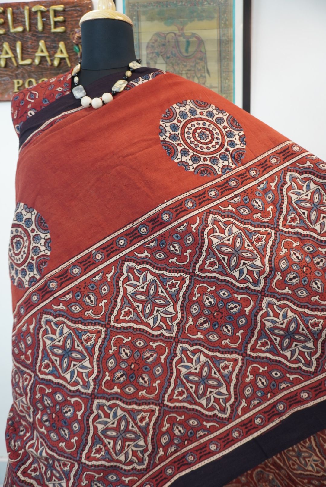 Red Ajrakh cotton saree with geometric circle design in white, blue and black