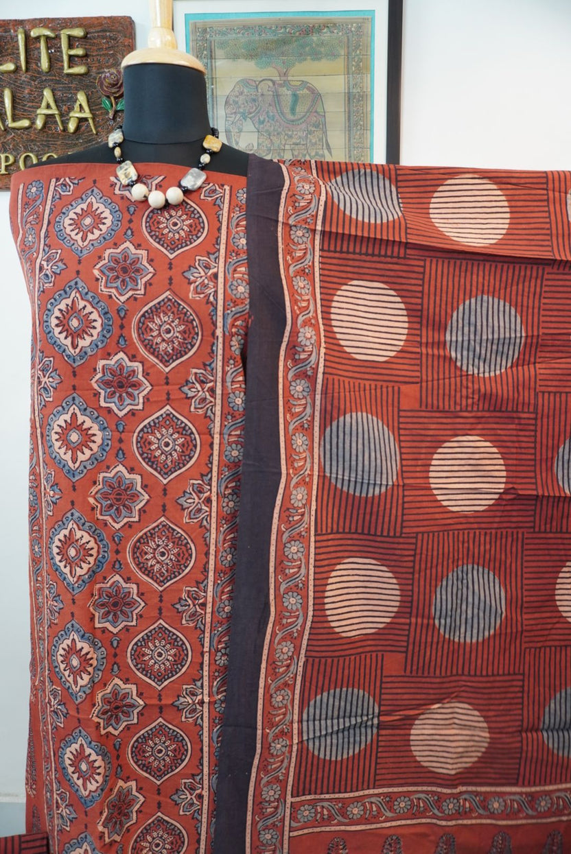 Cotton Ajrakh 3 piece dress material in red rust with placement pattern, border and tassels