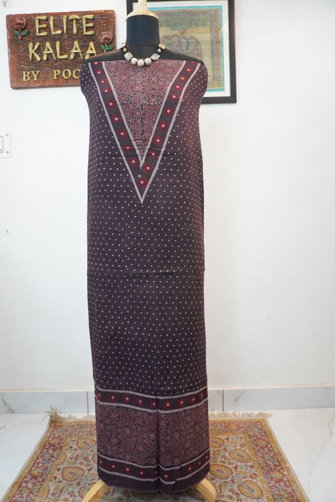 Brown Ajrakh-style block print kurta fabric with red and cream details and a border