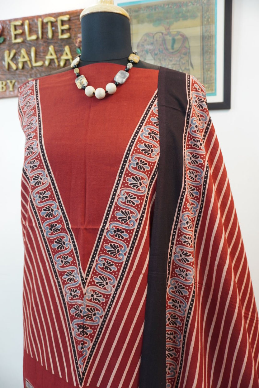Red Ajrakh handblock kala cotton kurta fabric with black, cream and grey block pattern and border detail