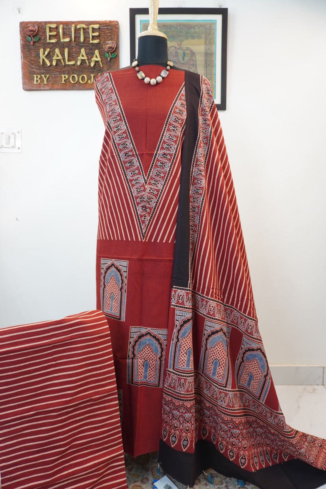 Red Ajrakh handblock kala cotton kurta fabric with black, cream and grey block pattern and border detail