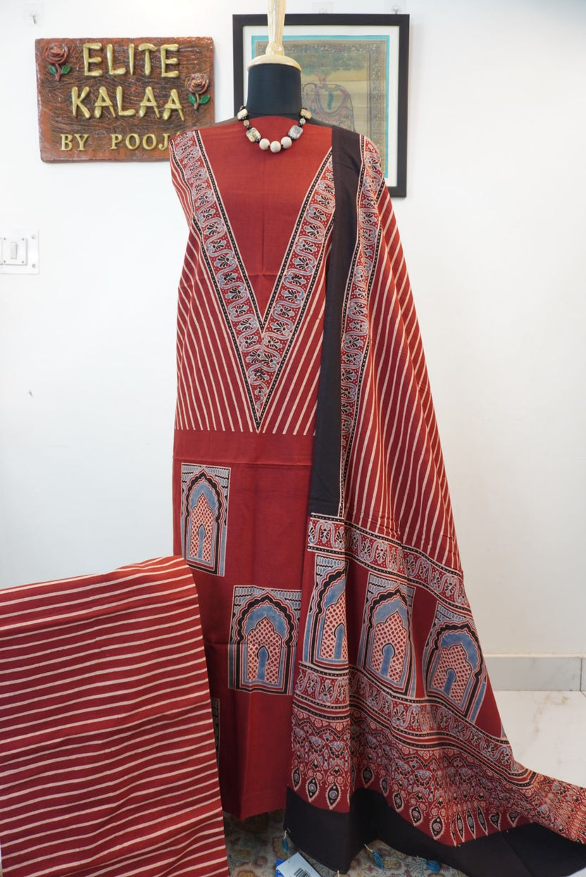 Red Ajrakh handblock kala cotton kurta fabric with black, cream and grey block pattern and border detail