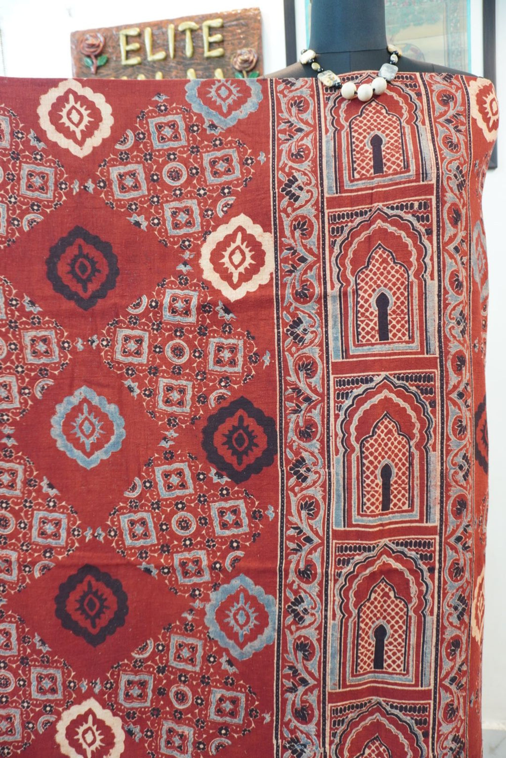 Red Ajrakh handblock kala cotton kurta fabric with black, cream and grey block pattern and border detail