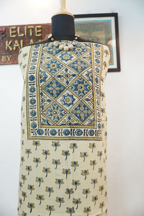 Cream kurta fabric with blue, beige and black block print pattern, border detail and fringe