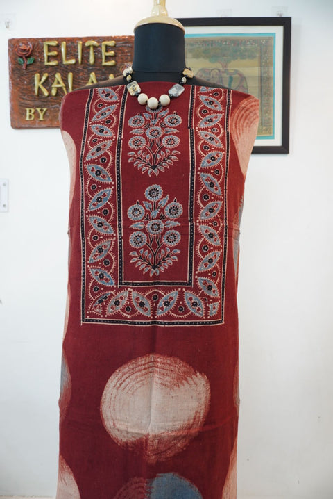 Red rust kurti fabric with multicolor block print pattern and visible border